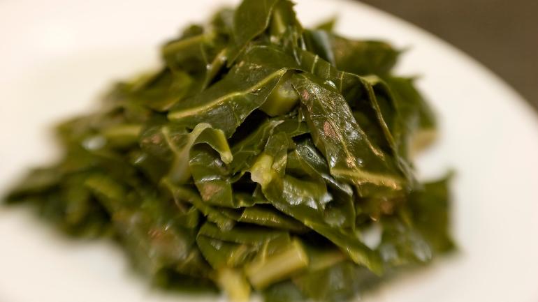 Leafy collard greens, traditionally slow-cooked Leafy collard greens, traditionally slow-cooked